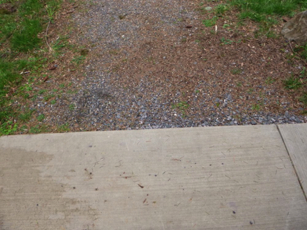 Paved surface to natural surface may require maintenance to avoid a lip